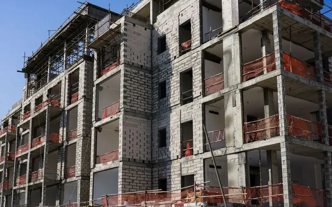 Block of flats going up behind scaffolding